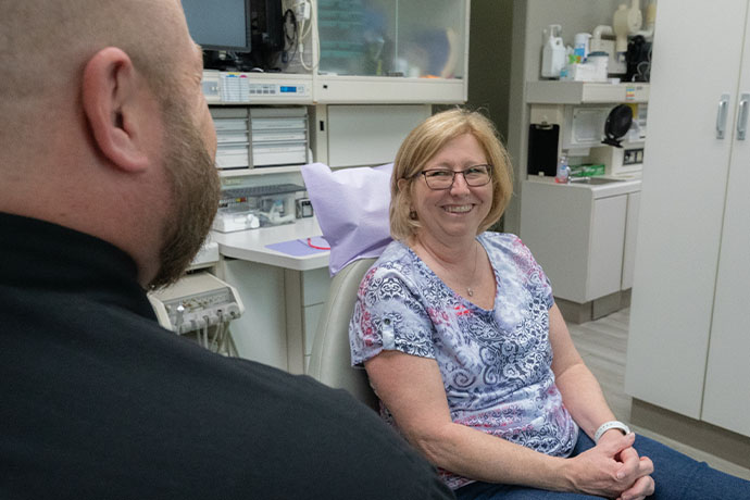female patient with Dr. Jacob A. Burch inside Copperfield Dentistry office in Houston, TX